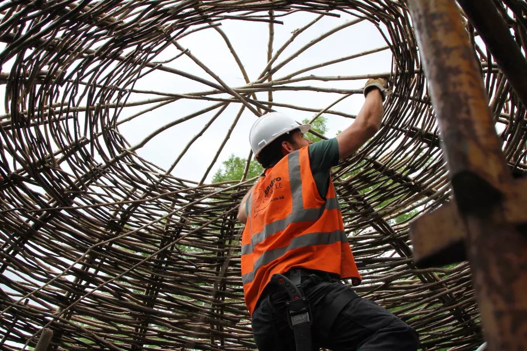 Constructing the woven hazel roundhouse at the Scottish Crannog Centre, Loch Tay, 2023. 